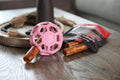 JW Pet HOL-ee Roller™, Dog Toy Puzzle Ball, Natural Rubber, Medium (4.5” Inch Diameter), Pink